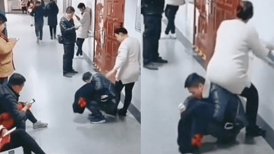 Husband turns himself into a human chair so his pregnant wife can sit 